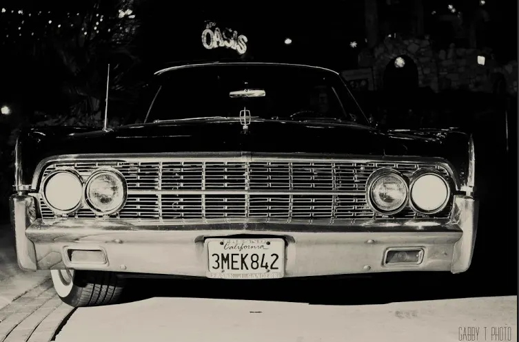 Front end view of '62 Lincoln Continental Convertible owned and operated by 4Leaf Limos of Austin Texas Limousine 